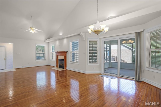 14 Berry Patch Ln, Glen Carbon, IL 62034 - unfurnished living room featuring a chandelier, healthy amount of natural light, wood-type flooring, and lofted ceiling