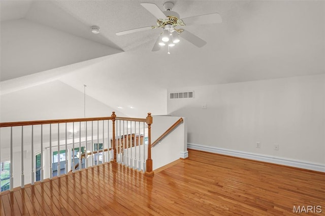 14 Berry Patch Ln, Glen Carbon, IL 62034 - bonus room featuring a ceiling fan, vaulted ceiling, baseboards, and wood finished floors