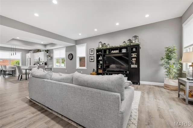 2034 Ann Ave, Saint Louis, MO 63104 - living area featuring healthy amount of natural light, light wood finished floors, recessed lighting, and baseboards