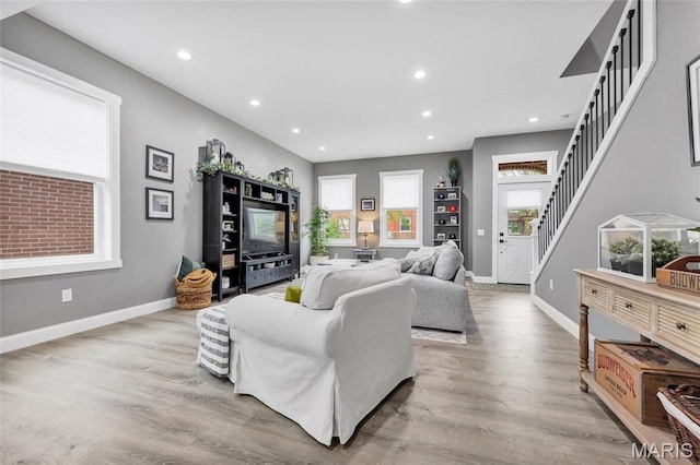 2034 Ann Ave, Saint Louis, MO 63104 - living area with stairs, recessed lighting, wood finished floors, and baseboards