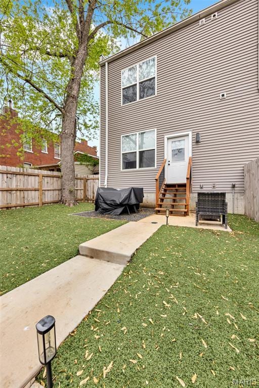 2034 Ann Ave, Saint Louis, MO 63104 - rear view of house featuring entry steps and a patio area