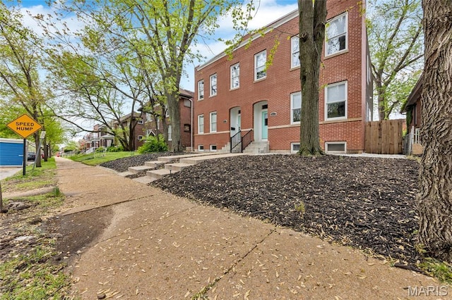 2034 Ann Ave, Saint Louis, MO 63104 - view of front of home featuring brick siding and fence