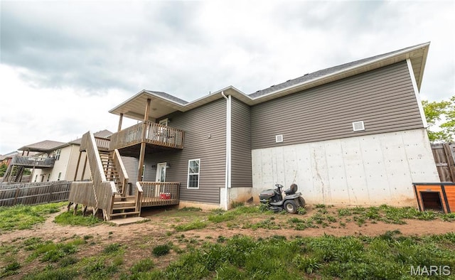20256 Hardcastle Ln, Saint Robert, MO 65584 - rear view of house with a wooden deck
