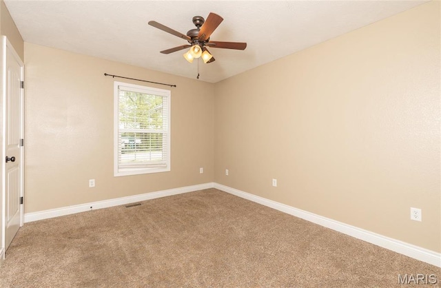 20256 Hardcastle Ln, Saint Robert, MO 65584 - carpeted spare room with baseboards and ceiling fan