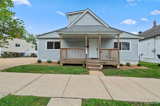 1326 Graham St, Saint Louis, MO 63139 - bungalow-style house featuring a porch and roof with shingles