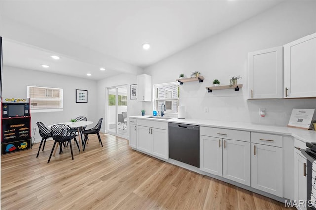 1326 Graham St, Saint Louis, MO 63139 - kitchen featuring dishwasher, a sink, light countertops, recessed lighting, and light wood-style floors