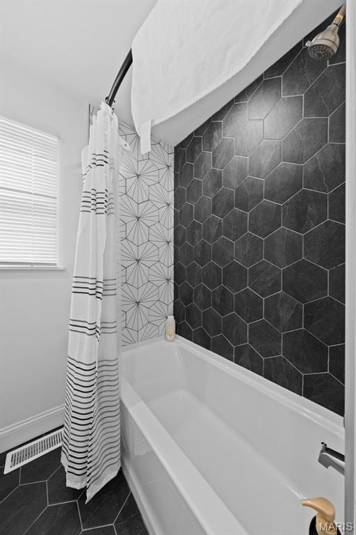 1326 Graham St, Saint Louis, MO 63139 - full bathroom with tile patterned flooring, shower / tub combo with curtain, and baseboards