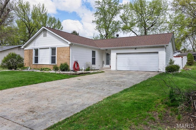 single story home with concrete driveway, an attached garage, a front lawn, and brick siding