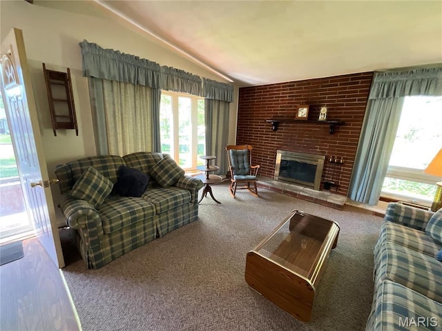 805 Willoway Ave, East Alton, IL 62024 - living area with carpet floors, lofted ceiling, and a fireplace