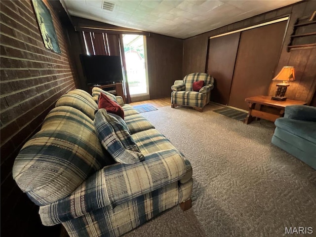805 Willoway Ave, East Alton, IL 62024 - carpeted living room featuring wood walls