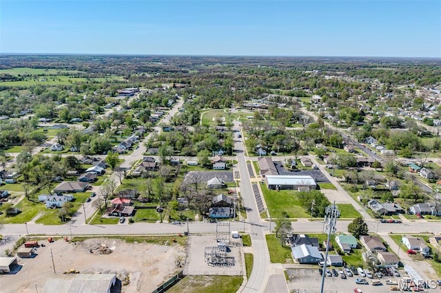 aerial overview of property's location with nearby suburban area