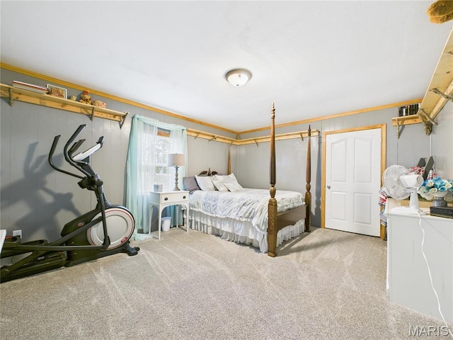 carpeted bedroom with ornamental molding