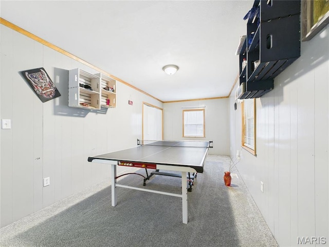 playroom with carpet floors and ornamental molding