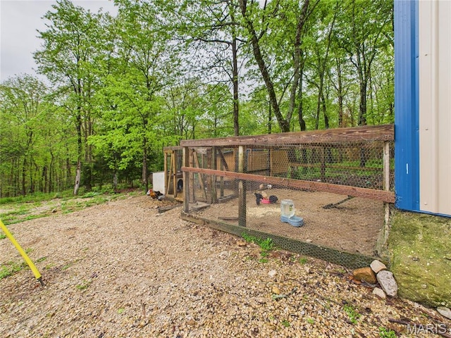 view of community featuring exterior structure and an outdoor structure