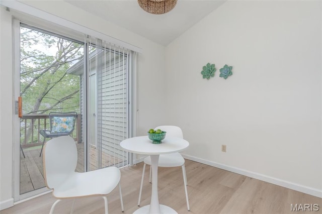 9162 Eager Rd, Saint Louis, MO 63144 - dining room with wood finished floors, vaulted ceiling, healthy amount of natural light, and baseboards