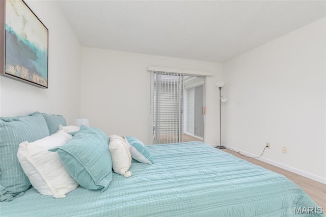 9162 Eager Rd, Saint Louis, MO 63144 - bedroom with wood finished floors and baseboards