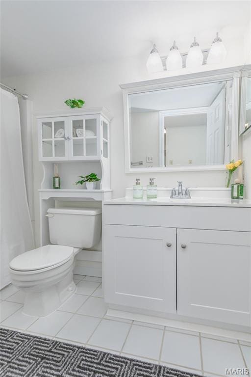 9162 Eager Rd, Saint Louis, MO 63144 - bathroom with toilet, vanity, tile patterned floors, and curtained shower