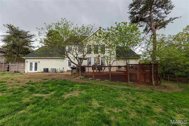 view of yard featuring a deck and french doors