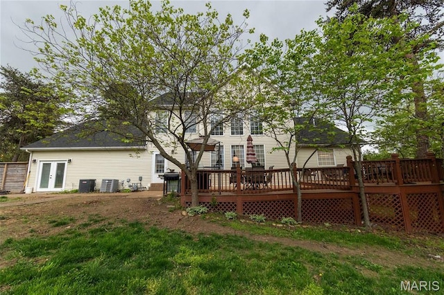 back of house with a wooden deck, cooling unit, and french doors