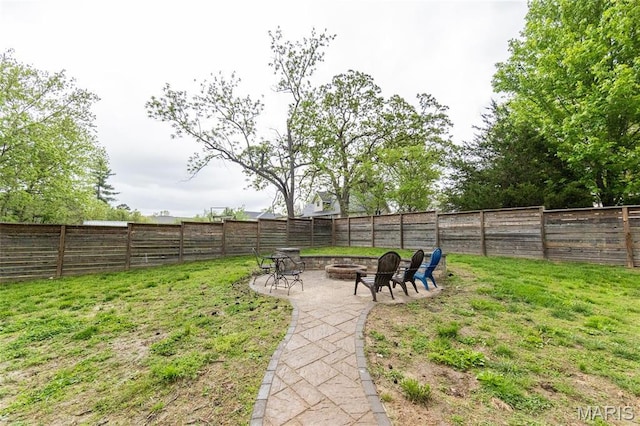 view of yard with an outdoor fire pit and a patio area