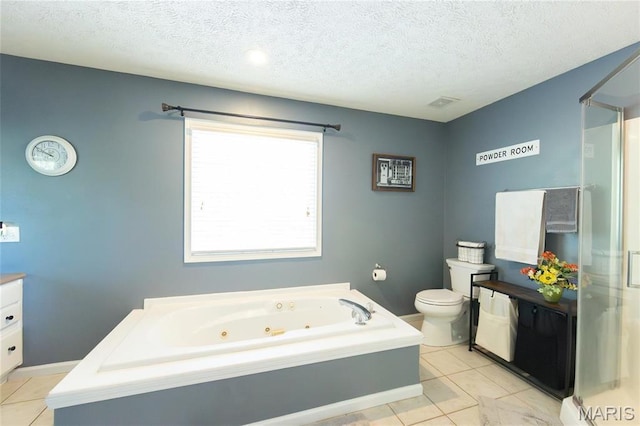 bathroom featuring tile patterned floors, vanity, toilet, a stall shower, and a textured ceiling