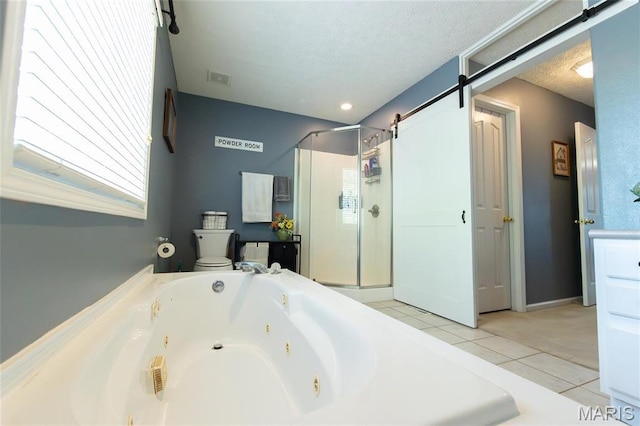 full bathroom featuring a stall shower, tile patterned floors, a tub with jets, and a textured ceiling
