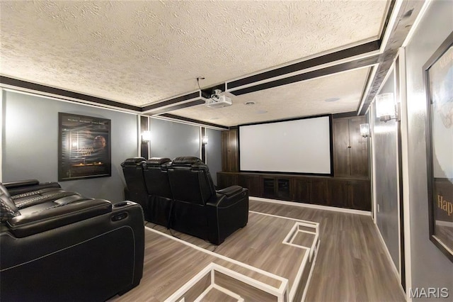home theater with a textured ceiling and wood finished floors