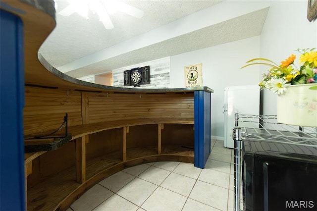reception featuring a textured ceiling and a ceiling fan