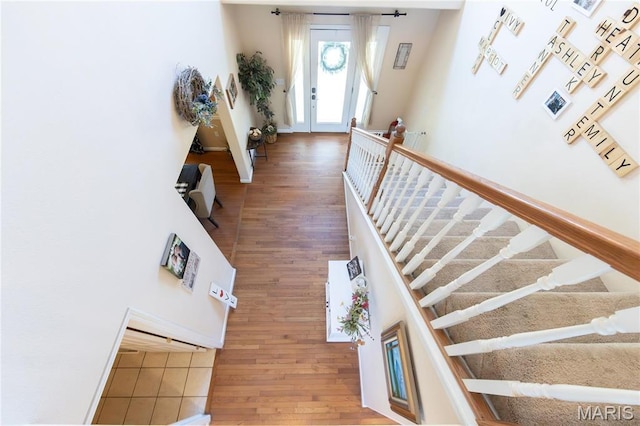 stairway with wood finished floors