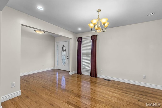 2600 Cobblestone Ct, Cape Girardeau, MO 63701 - unfurnished room featuring a chandelier, wood finished floors, baseboards, and recessed lighting