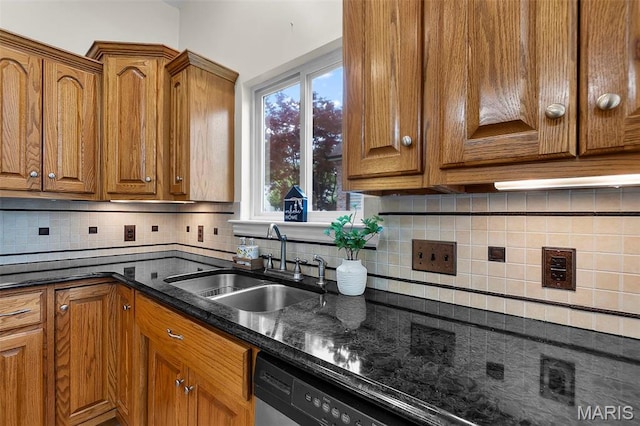 2600 Cobblestone Ct, Cape Girardeau, MO 63701 - kitchen featuring a sink, brown cabinetry, decorative backsplash, and dark stone countertops