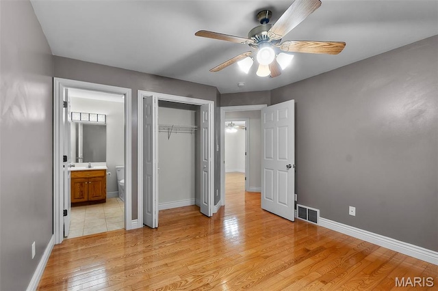 2600 Cobblestone Ct, Cape Girardeau, MO 63701 - unfurnished bedroom featuring light wood-type flooring, a closet, baseboards, and ensuite bath