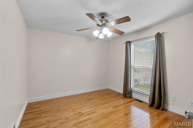 2600 Cobblestone Ct, Cape Girardeau, MO 63701 - spare room with light wood-style floors, a ceiling fan, and baseboards
