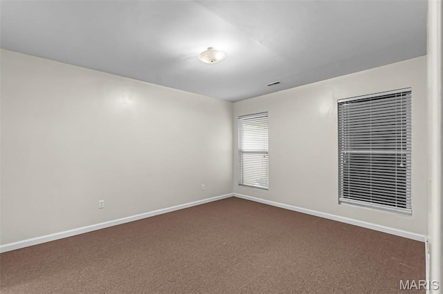 2600 Cobblestone Ct, Cape Girardeau, MO 63701 - unfurnished room with dark carpet and baseboards