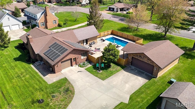 aerial view of residential area featuring a pool