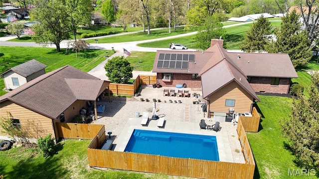 view of subject property with a pool area