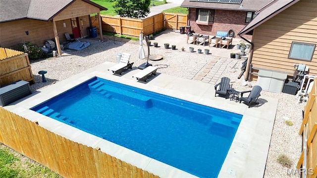 view of pool with a patio area and a fenced backyard
