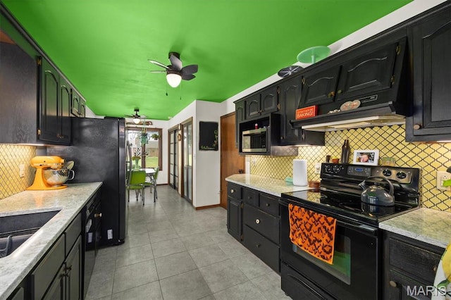 kitchen featuring stainless steel appliances, ceiling fan, backsplash, and dark cabinets