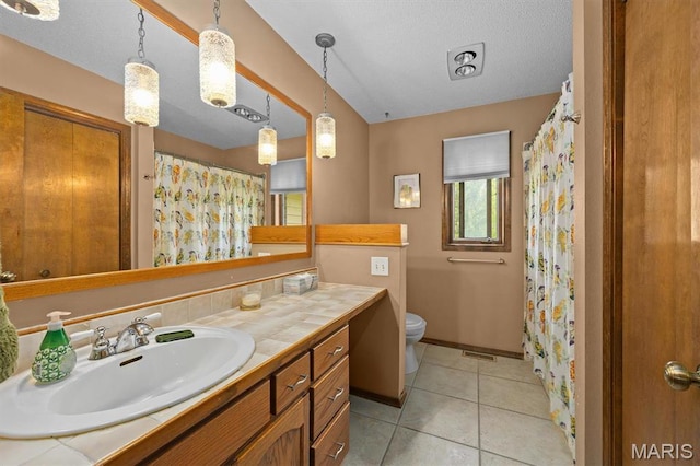 full bathroom featuring toilet, vanity, baseboards, tile patterned floors, and a shower with curtain