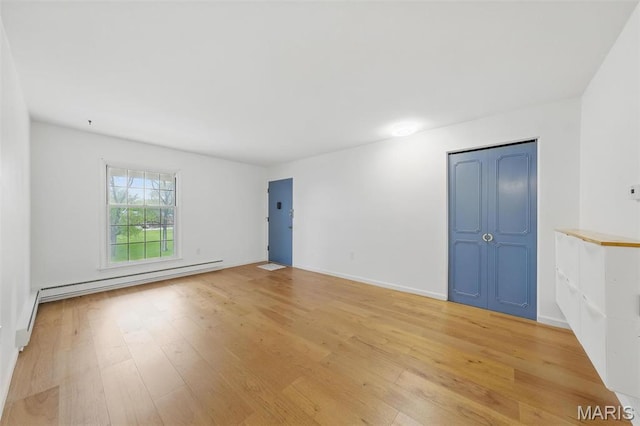 3214 Roger Williams Dr Unit D, Bridgeton, MO 63044 - spare room featuring light wood-style floors, baseboard heating, and baseboards