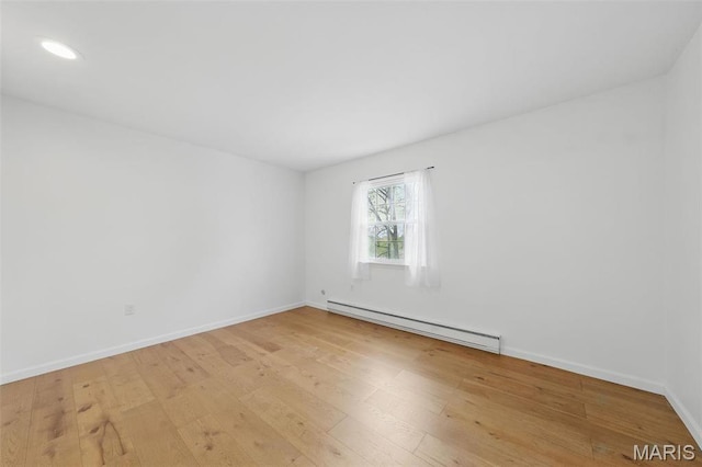 3214 Roger Williams Dr Unit D, Bridgeton, MO 63044 - spare room with baseboard heating, light wood finished floors, recessed lighting, and baseboards