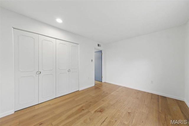 3214 Roger Williams Dr Unit D, Bridgeton, MO 63044 - unfurnished bedroom with light wood-type flooring, baseboards, recessed lighting, and a closet