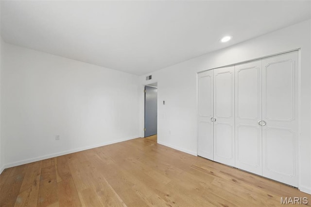 3214 Roger Williams Dr Unit D, Bridgeton, MO 63044 - unfurnished bedroom featuring light wood finished floors, baseboards, recessed lighting, and a closet