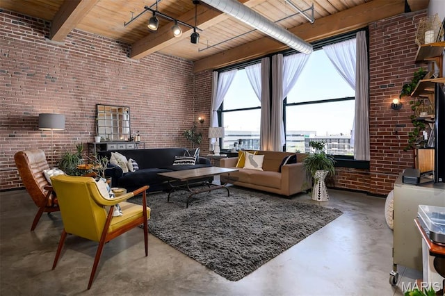 901 Washington Ave Unit 411, Saint Louis, MO 63101 - living area featuring brick wall, wooden ceiling, finished concrete flooring, and beam ceiling