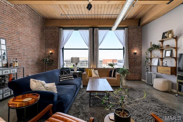 901 Washington Ave Unit 411, Saint Louis, MO 63101 - living room with brick wall, finished concrete floors, and wooden ceiling