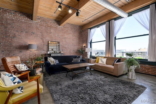 901 Washington Ave Unit 411, Saint Louis, MO 63101 - living area featuring brick wall, concrete flooring, wooden ceiling, and beam ceiling