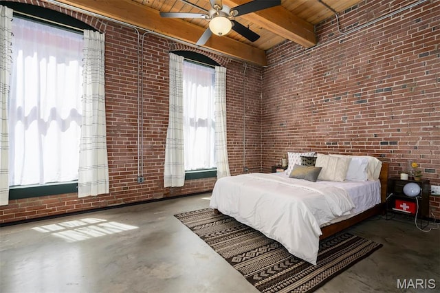 901 Washington Ave Unit 411, Saint Louis, MO 63101 - bedroom with brick wall, concrete flooring, wooden ceiling, beamed ceiling, and ceiling fan