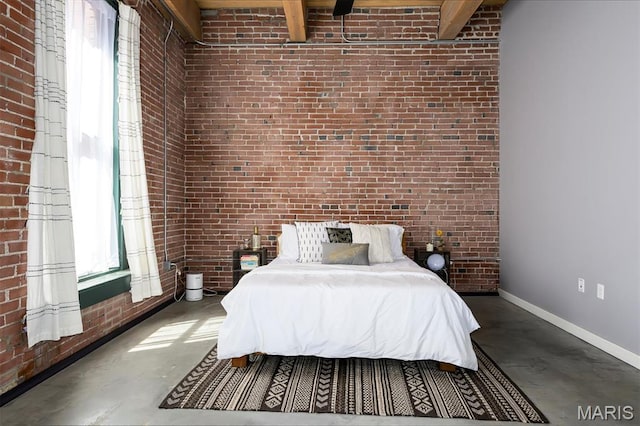 901 Washington Ave Unit 411, Saint Louis, MO 63101 - bedroom with concrete floors, brick wall, beam ceiling, and baseboards