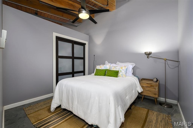 901 Washington Ave Unit 411, Saint Louis, MO 63101 - bedroom with baseboards, a ceiling fan, and concrete flooring