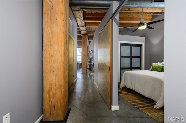 901 Washington Ave Unit 411, Saint Louis, MO 63101 - bedroom featuring baseboards and finished concrete flooring